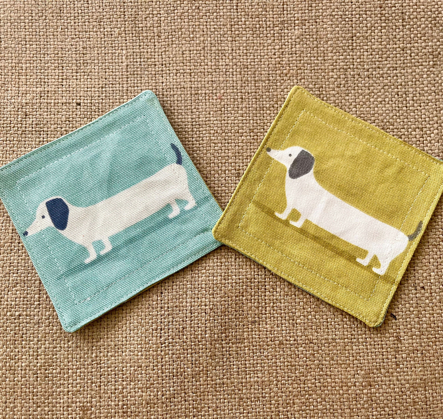 Blue and Yellow Dachshund Print Fabric Coasters Double Sided Set of 2. Sausage dog print reversible different colour on each side.