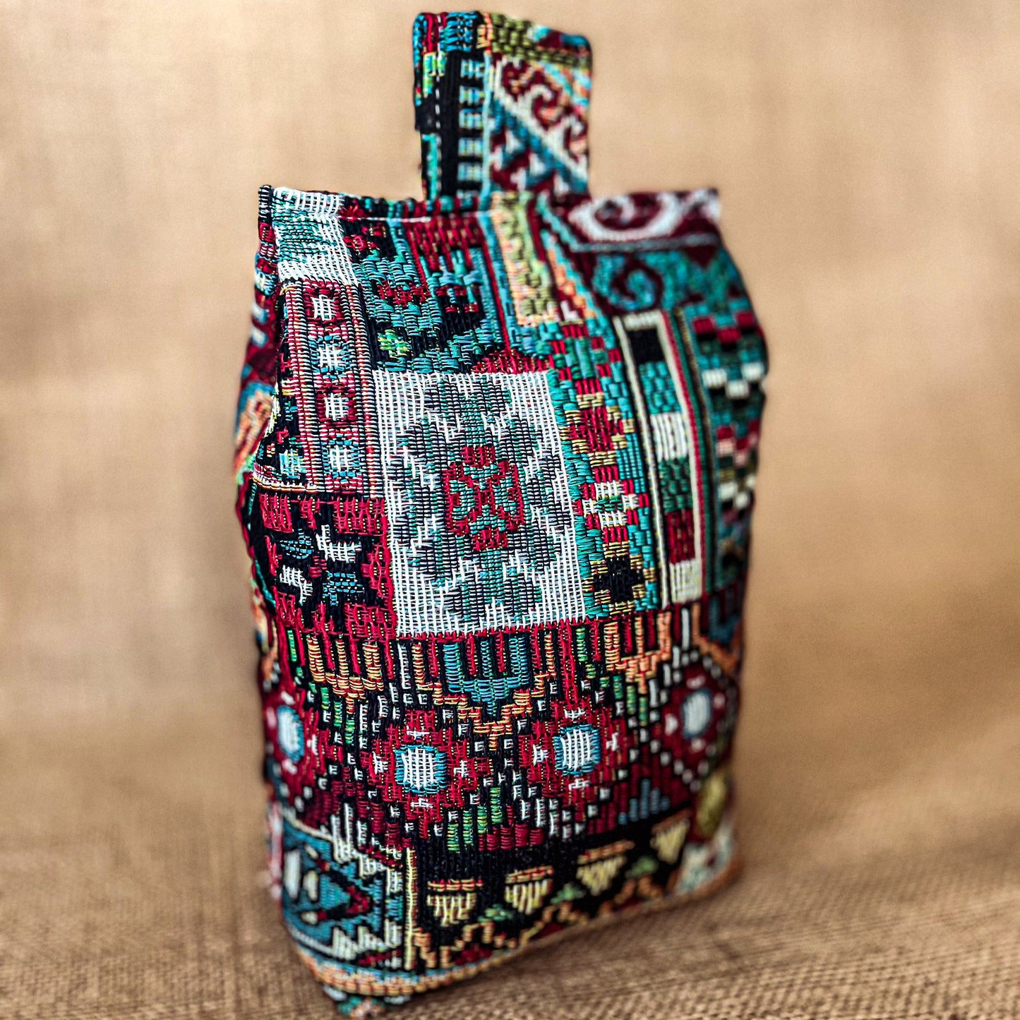 Handcrafted large Moroccan-inspired wheat-filled door stop, crafted from durable tapestry fabric in vibrant red & blue rustic hues. Measures 22cm tall x 15cm x 7cm at the base. Perfect gift available filled or with Velcro closing to fill at home.