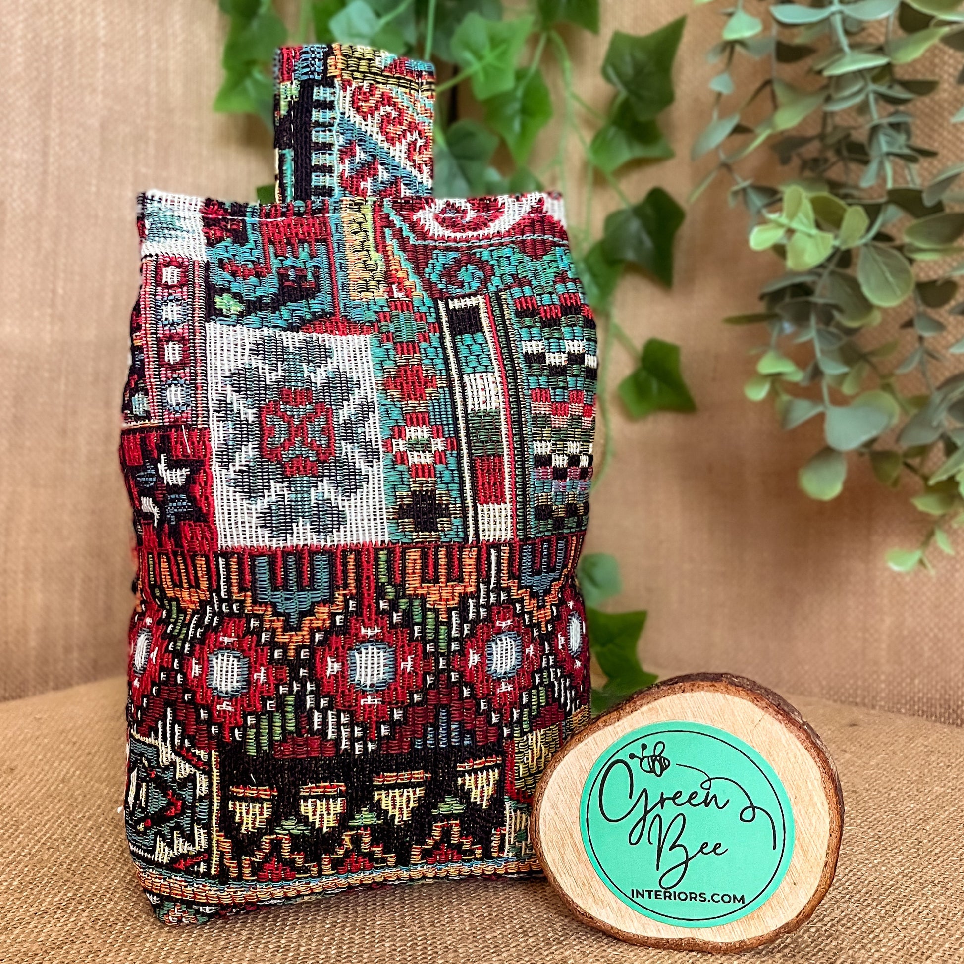 Handcrafted Moroccan-inspired wheat-filled door stop, crafted from durable woven tapestry fabric in vibrant red and blue rustic hues. Measures 22cm tall x 15cm x 7cm at the base