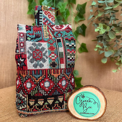 Handcrafted Moroccan-inspired wheat-filled door stop, crafted from durable woven tapestry fabric in vibrant red and blue rustic hues. Measures 22cm tall x 15cm x 7cm at the base
