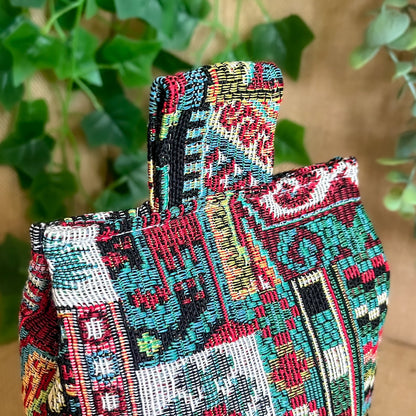 Handcrafted large Moroccan-inspired wheat-filled door stop, crafted from durable tapestry fabric in vibrant red & blue rustic hues. Measures 22cm tall x 15cm x 7cm at the base. Perfect gift available filled or with Velcro closing to fill at home.