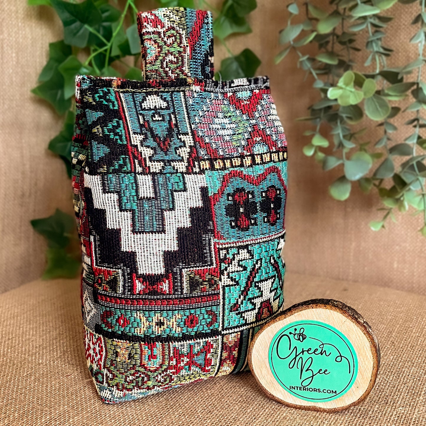 Handcrafted Moroccan-inspired wheat-filled door stop, crafted from durable woven tapestry fabric in vibrant red and blue rustic hues. Measures 22cm tall x 15cm x 7cm at the base.