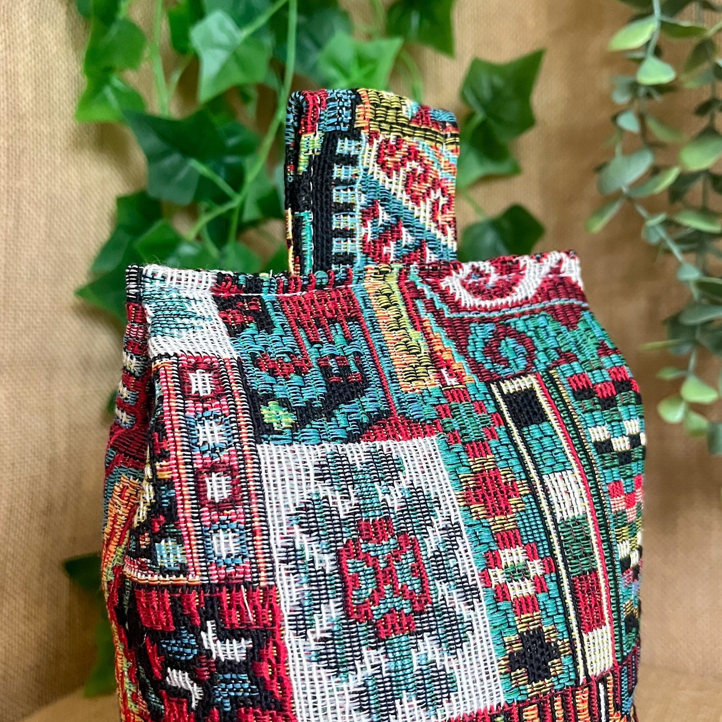 Handcrafted large Moroccan-inspired wheat-filled door stop, crafted from durable tapestry fabric in vibrant red & blue rustic hues. Measures 22cm tall x 15cm x 7cm at the base. Perfect gift available filled or with Velcro closing to fill at home.