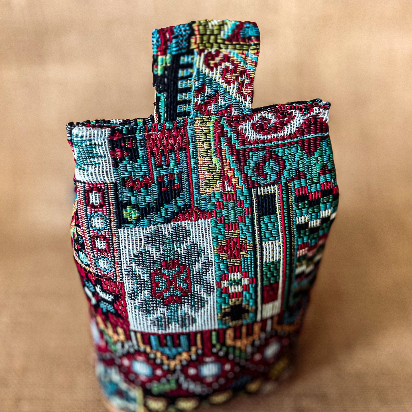 Handcrafted large Moroccan-inspired wheat-filled door stop, crafted from durable tapestry fabric in vibrant red & blue rustic hues. Measures 22cm tall x 15cm x 7cm at the base. Perfect gift available filled or with Velcro closing to fill at home.