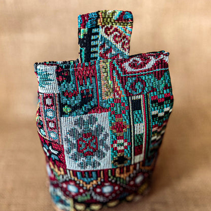 Handcrafted large Moroccan-inspired wheat-filled door stop, crafted from durable tapestry fabric in vibrant red & blue rustic hues. Measures 22cm tall x 15cm x 7cm at the base. Perfect gift available filled or with Velcro closing to fill at home.