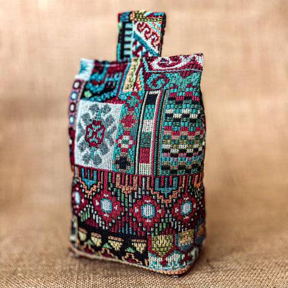Handcrafted large Moroccan-inspired wheat-filled door stop, crafted from durable tapestry fabric in vibrant red & blue rustic hues. Measures 22cm tall x 15cm x 7cm at the base. Perfect gift available filled or with Velcro closing to fill at home.