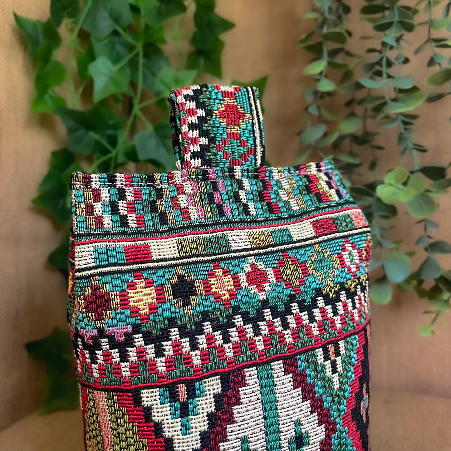 Handcrafted large Indian-inspired wheat-filled door stop, crafted from durable tapestry fabric in vibrant red & blue rustic hues. Measures 22cm tall x 15cm x 7cm at the base. Perfect gift available filled or with Velcro closing to fill at home.