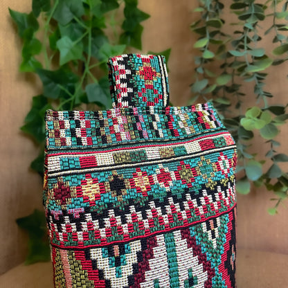 Handcrafted large Indian-inspired wheat-filled door stop, crafted from durable tapestry fabric in vibrant red & blue rustic hues. Measures 22cm tall x 15cm x 7cm at the base. Perfect gift available filled or with Velcro closing to fill at home.