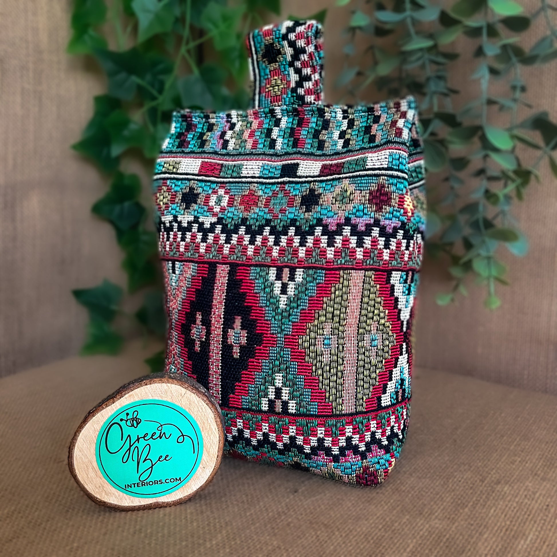 Handcrafted large Indian-inspired wheat-filled door stop, crafted from durable tapestry fabric in vibrant red & blue rustic hues. Measures 22cm tall x 15cm x 7cm at the base. Perfect gift available filled or with Velcro closing to fill at home.